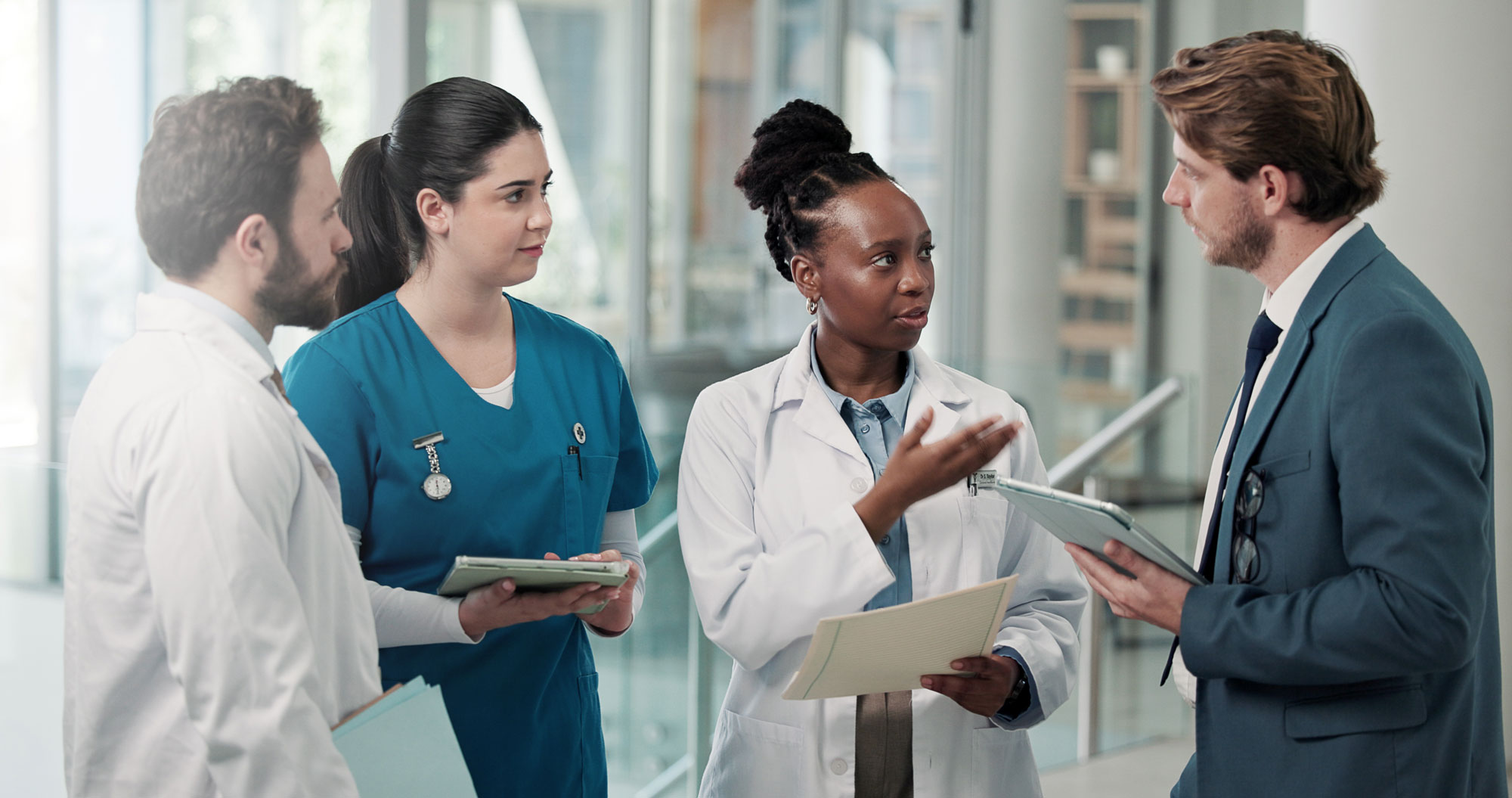Healthcare professionals discussing patient notes